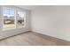 Bedroom with hardwood floors and double windows for natural light at 2191 Helm Ave, North Charleston, SC 29405