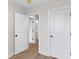 Bedroom view with hardwood floors, white walls, white doors and black hardware at 2191 Helm Ave, North Charleston, SC 29405