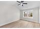 Bright bedroom with a modern ceiling fan, hardwood floors and a window with backyard views at 2191 Helm Ave, North Charleston, SC 29405