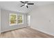 Bright bedroom with a ceiling fan, hardwood floors and a window that lets in lots of natural light at 2191 Helm Ave, North Charleston, SC 29405