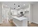 Bright kitchen features stainless steel appliances, white cabinetry, and an island with a sink at 2191 Helm Ave, North Charleston, SC 29405