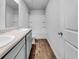 Bathroom with double sinks, wood-look flooring, and shower-tub combination at 246 Spencer Cir, Summerville, SC 29485