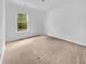 Simple bedroom featuring a window with natural light and carpet flooring at 246 Spencer Cir, Summerville, SC 29485
