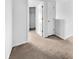 Bright hallway with neutral carpet, white walls, and access to several rooms at 246 Spencer Cir, Summerville, SC 29485