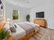 Cozy main bedroom features natural light, light colored walls, and a plush bed at 246 Spencer Cir, Summerville, SC 29485
