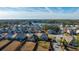 Aerial view of a residential community featuring a lake and well-maintained homes at 2734 Sunrose Ln, Johns Island, SC 29455