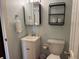 Bright bathroom features a single sink, commode, and toiletries at 280 Driftwood Ln, Edisto Beach, SC 29438