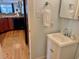 Bright bathroom features a white vanity, towel bar, and framed mirror at 280 Driftwood Ln, Edisto Beach, SC 29438