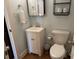 Bright bathroom features a single sink, commode, and toiletries at 280 Driftwood Ln, Edisto Beach, SC 29438