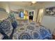Well-lit bedroom with a comfortable bed and view into an adjacent room at 280 Driftwood Ln, Edisto Beach, SC 29438