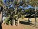 Picturesque golf course featuring a winding cart path surrounded by mature trees at 280 Driftwood Ln, Edisto Beach, SC 29438
