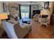 Comfortable living room with lots of natural light, with a sofa, two chairs, and TV at 280 Driftwood Ln, Edisto Beach, SC 29438
