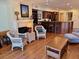 Bright living area featuring a fireplace and seamless flow to the dining and kitchen space at 280 Driftwood Ln, Edisto Beach, SC 29438