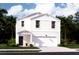 Charming two-story home with white siding, attached garage and well-maintained landscaping at 306 Pine Crest View Dr, Summerville, SC 29486