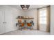 Bright office space with a custom built-in desk, ample shelving, and a window for natural light at 306 Pine Crest View Dr, Summerville, SC 29486
