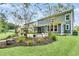 Well manicured backyard featuring a landscaped garden and screened in patio at 331 Weston Hall Dr, Summerville, SC 29483