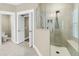 Bright bathroom with tiled glass shower and dual doors at 331 Weston Hall Dr, Summerville, SC 29483