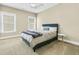 Inviting bedroom with a cozy bed, carpeted floors, and natural light streaming through the windows at 331 Weston Hall Dr, Summerville, SC 29483