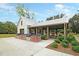 Community outdoor kitchen with grills and picnic tables under a covered pavilion at 331 Weston Hall Dr, Summerville, SC 29483
