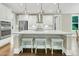 Cozy dining room with a wood table, chairs, and a large window overlooking the backyard at 331 Weston Hall Dr, Summerville, SC 29483