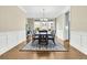 Bright dining room featuring a wood table with seating for eight and a large area rug at 331 Weston Hall Dr, Summerville, SC 29483