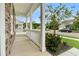 Inviting front porch featuring stone accents, white columns, and neighborhood views at 331 Weston Hall Dr, Summerville, SC 29483