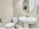 Cozy half bathroom featuring a pedestal sink, round mirror, and neutral wall color at 331 Weston Hall Dr, Summerville, SC 29483
