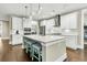 Kitchen island with quartz countertops and stainless appliances beneath pendant lights at 331 Weston Hall Dr, Summerville, SC 29483
