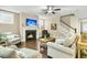 Inviting living room with a fireplace, hardwood floors, comfortable seating, and lots of natural light at 331 Weston Hall Dr, Summerville, SC 29483