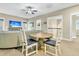 Cozy living room with a ceiling fan, TV, comfortable seating, and an adjacent dining area at 331 Weston Hall Dr, Summerville, SC 29483