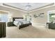 Spacious main bedroom featuring a decorative ceiling light fixture, large windows, and neutral colors at 331 Weston Hall Dr, Summerville, SC 29483