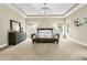 Elegantly designed main bedroom with a decorative ceiling light fixture and large windows at 331 Weston Hall Dr, Summerville, SC 29483