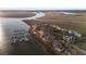 Breathtaking aerial view of the waterfront real estate and the surrounding marsh at 46 Mariners Cay Dr, Folly Beach, SC 29439
