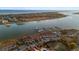 Beautiful aerial view of waterfront condos with marina, tennis court, and stunning waterfront views at 46 Mariners Cay Dr, Folly Beach, SC 29439