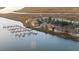 Aerial view of waterfront community with boat docks offering easy water access and scenic views at 46 Mariners Cay Dr, Folly Beach, SC 29439