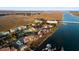Beautiful aerial view of the waterfront real estate and surrounding area at 46 Mariners Cay Dr, Folly Beach, SC 29439
