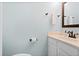 Well-lit bathroom with modern fixtures, including a sink and a dark-trimmed mirror at 46 Mariners Cay Dr, Folly Beach, SC 29439