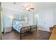 Comfortable bedroom with stylish decor, wood-look flooring, and serene lighting at 46 Mariners Cay Dr, Folly Beach, SC 29439