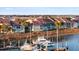 Waterfront condo exterior with private screened porches overlooking boat docks and water at 46 Mariners Cay Dr, Folly Beach, SC 29439