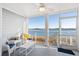 Relaxing screened-in porch with ample seating and a stunning waterfront view at 46 Mariners Cay Dr, Folly Beach, SC 29439