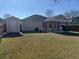 A full view of the backyard featuring a storage shed and covered patio at 5082 Westview St, North Charleston, SC 29418
