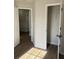 Bedroom featuring wood flooring, closet, and two doorways at 5082 Westview St, North Charleston, SC 29418