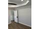 A bedroom with wood floors, light-colored walls, and a tray ceiling at 5082 Westview St, North Charleston, SC 29418