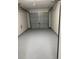 Spacious garage featuring a freshly painted floor, offering a clean and organized space for parking and storage at 5082 Westview St, North Charleston, SC 29418