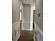 Interior view of hallway with hardwood floors and decorative trim at 5082 Westview St, North Charleston, SC 29418