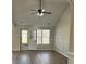 Bright living room featuring hardwood floors, ceiling fan, and a door leading outside at 5082 Westview St, North Charleston, SC 29418
