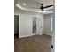 View of a main bedroom featuring hardwood floors, neutral paint and a ceiling fan at 5082 Westview St, North Charleston, SC 29418