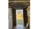 Interior view of the storage shed looking out at the back yard at 5082 Westview St, North Charleston, SC 29418