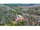 Aerial view of a secluded home in a wooded area, accessible by a winding driveway at 5585 Wire Road, Branchville, SC 29432