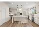 Bright kitchen with a large center island, stainless steel appliances, and ample counter space at 5585 Wire Road, Branchville, SC 29432